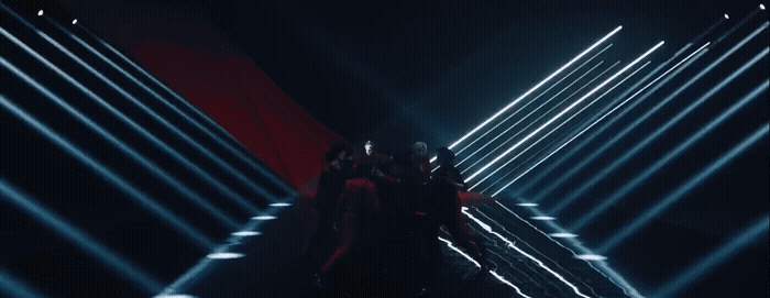 a group of people standing in a dark tunnel