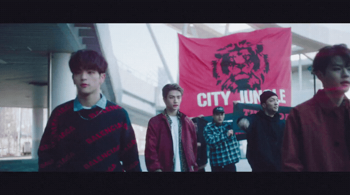 a group of young men standing next to each other