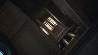 a room with a window and a clock on the wall