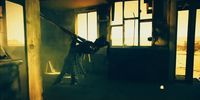 a woman is holding a sword in a dark room