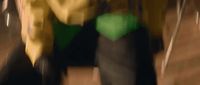 a blurry photo of a person walking down a street