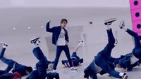 a group of young men performing a dance routine