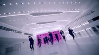 a group of people standing in a large room