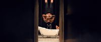 a man hanging upside down in a bathtub