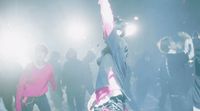 a group of people standing around each other
