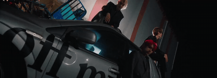 a police car parked in front of a building