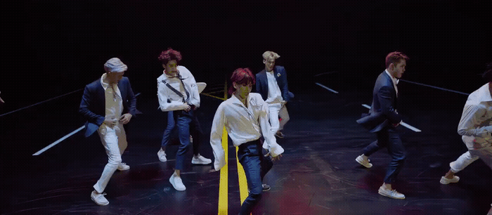 a group of young men standing on top of a stage