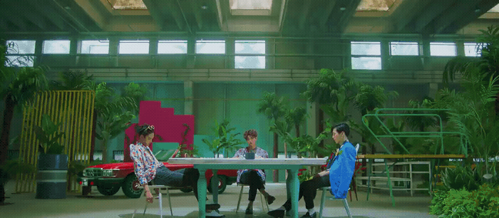 a group of people sitting around a table