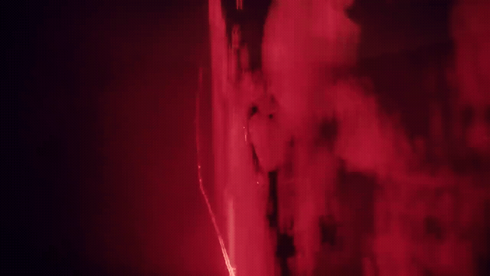 a red light is shining on a wall