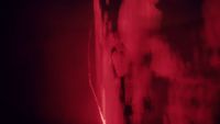 a red light is shining on a wall