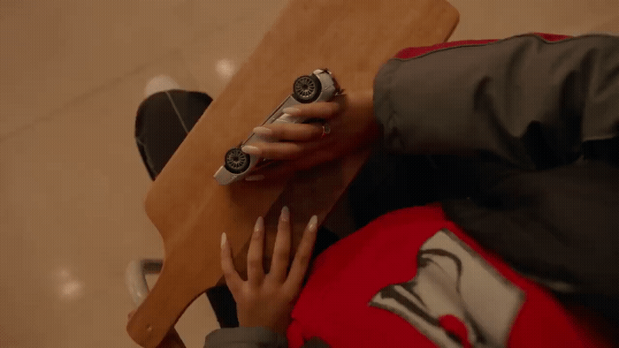a person holding a remote control in their hand