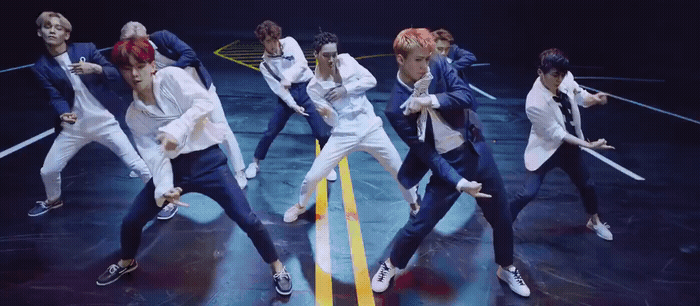 a group of young men dancing on a stage
