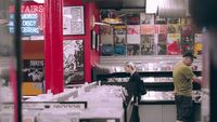a man and a woman standing in a store