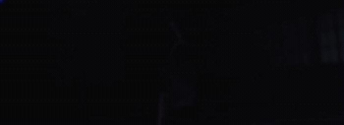 a blurry photo of a person in a dark room