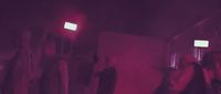 a group of people standing in a room