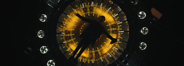 a clock with a person standing inside of it