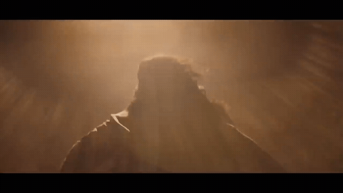 a blurry image of a man in a dark room