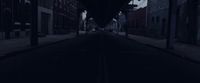 a dark street with a clock on the side of it