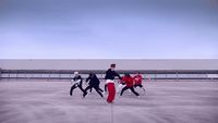 a group of people in a parking lot