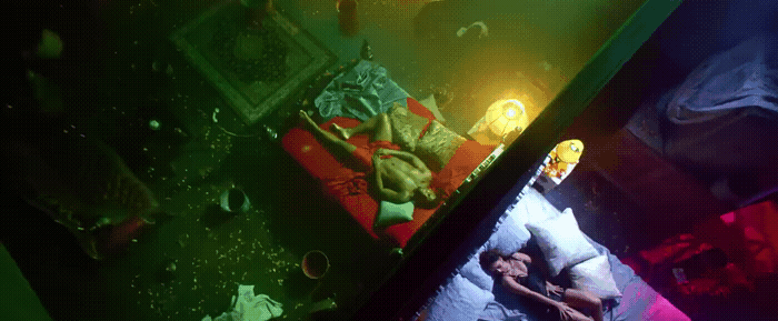 a person laying in a bed in a room