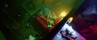 a person laying in a bed in a room