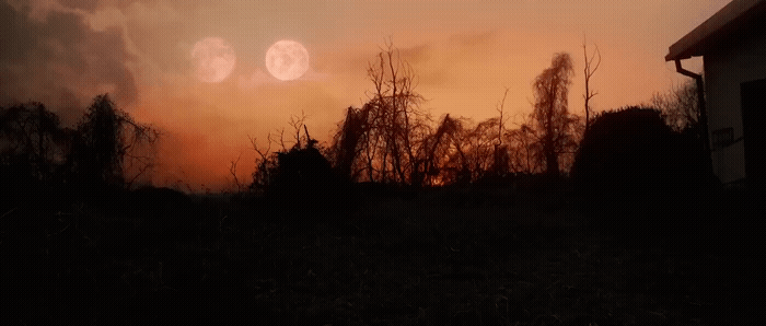 the sun is setting over a field with trees