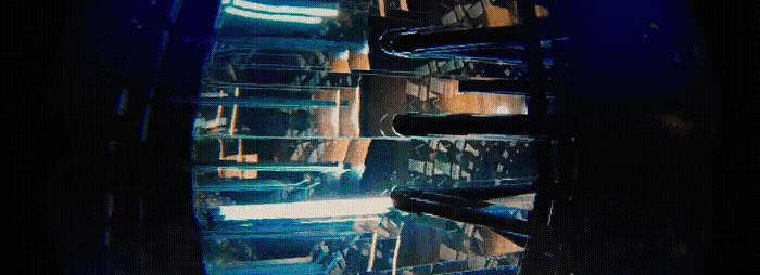a close up of a metal object with a blue background