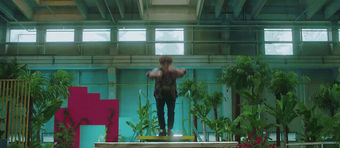 a man standing on a platform in a building