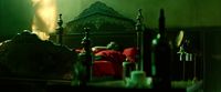 a man laying on a bed in a dark room