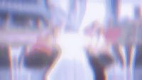 a blurry image of a woman walking down a street