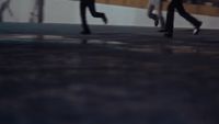 a couple of people that are walking down a street