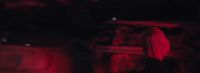 a blurry image of a person standing in the dark