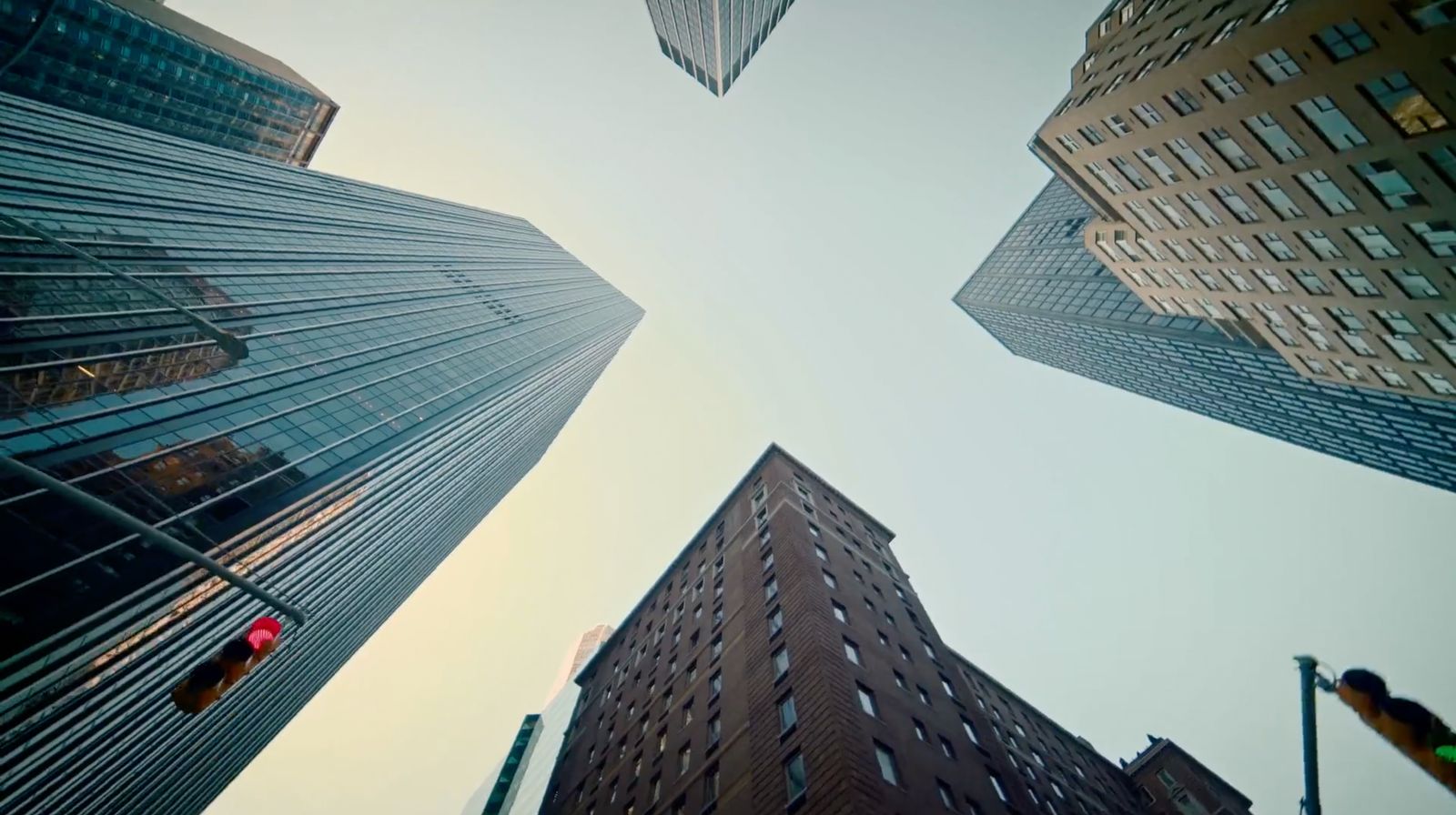 looking up at tall buildings in a city