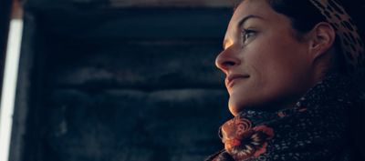 a woman with a scarf around her neck