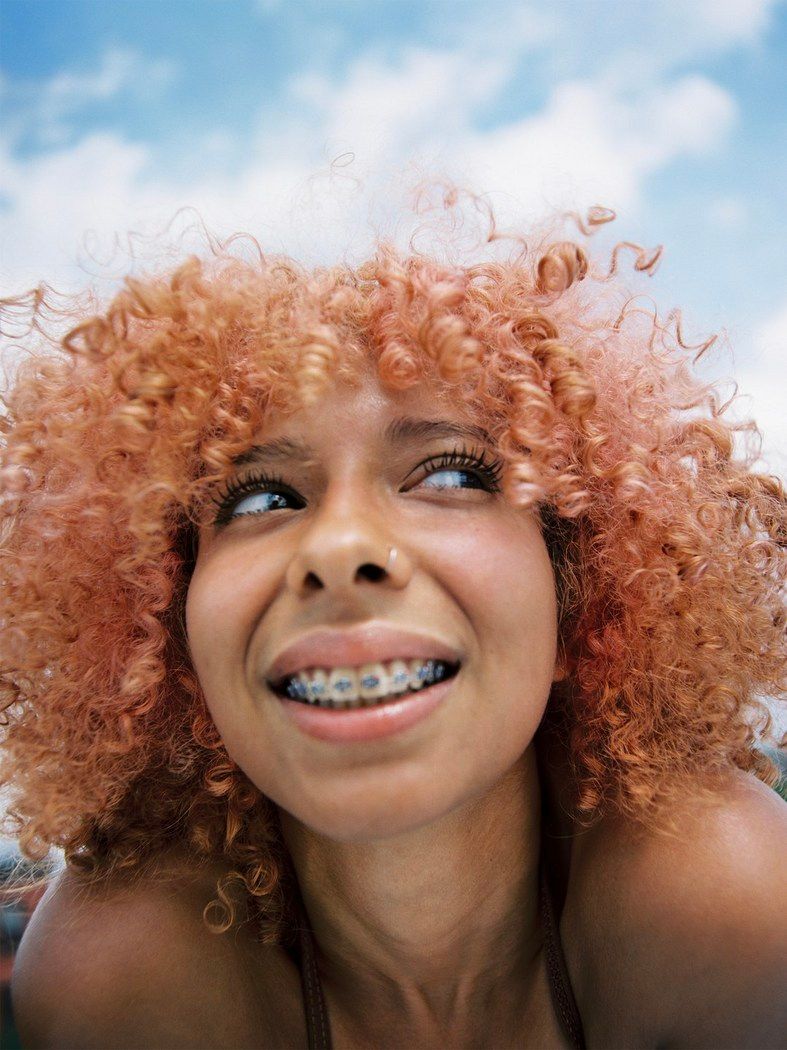 a woman with a toothbrush in her mouth