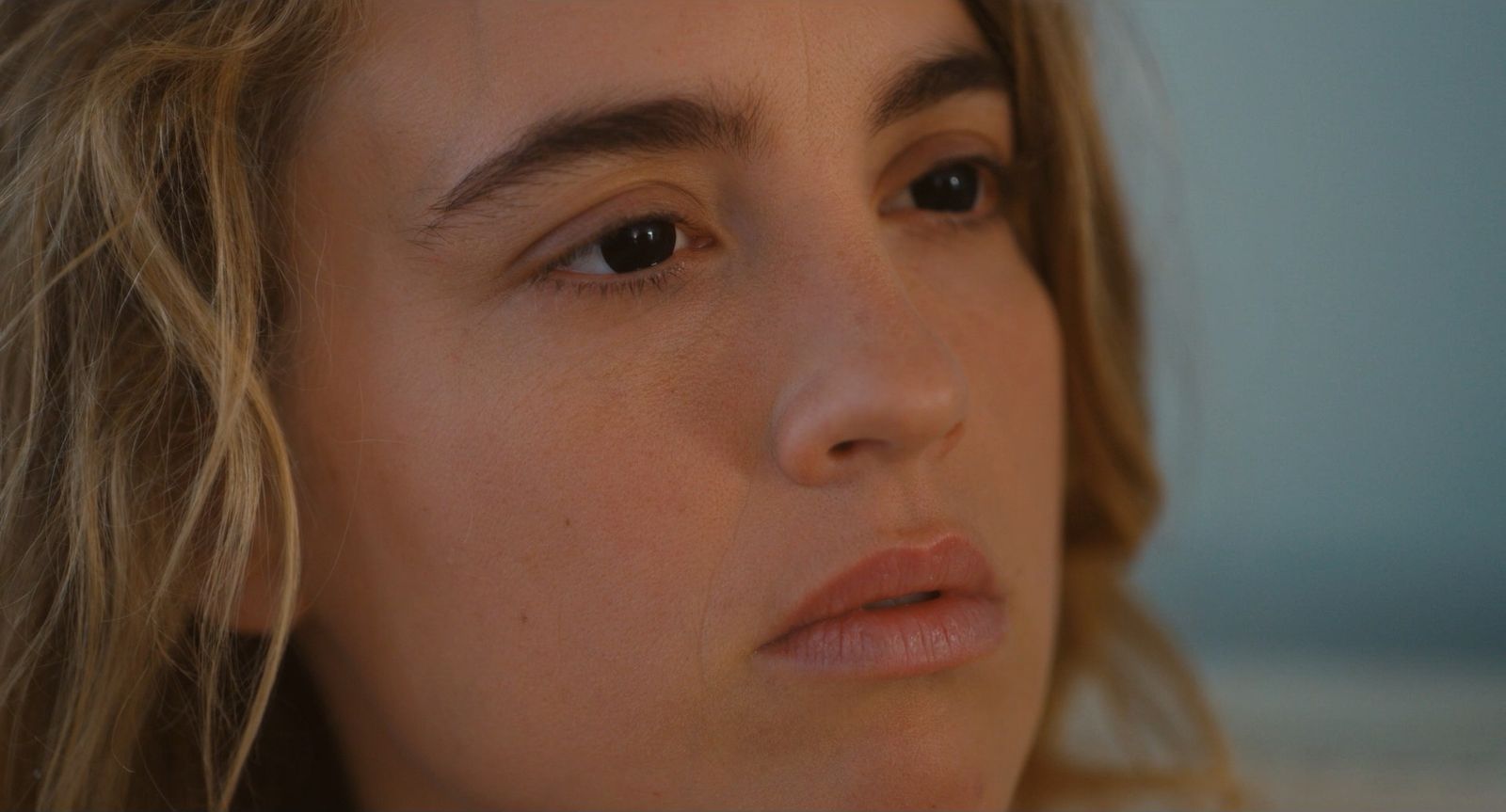 a close up of a person with long hair