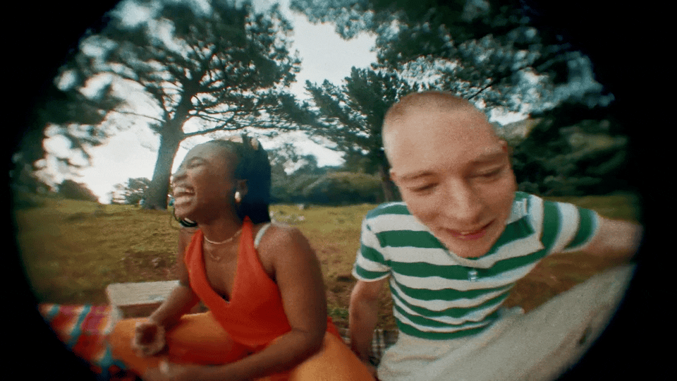 a man and a woman sitting on a bench