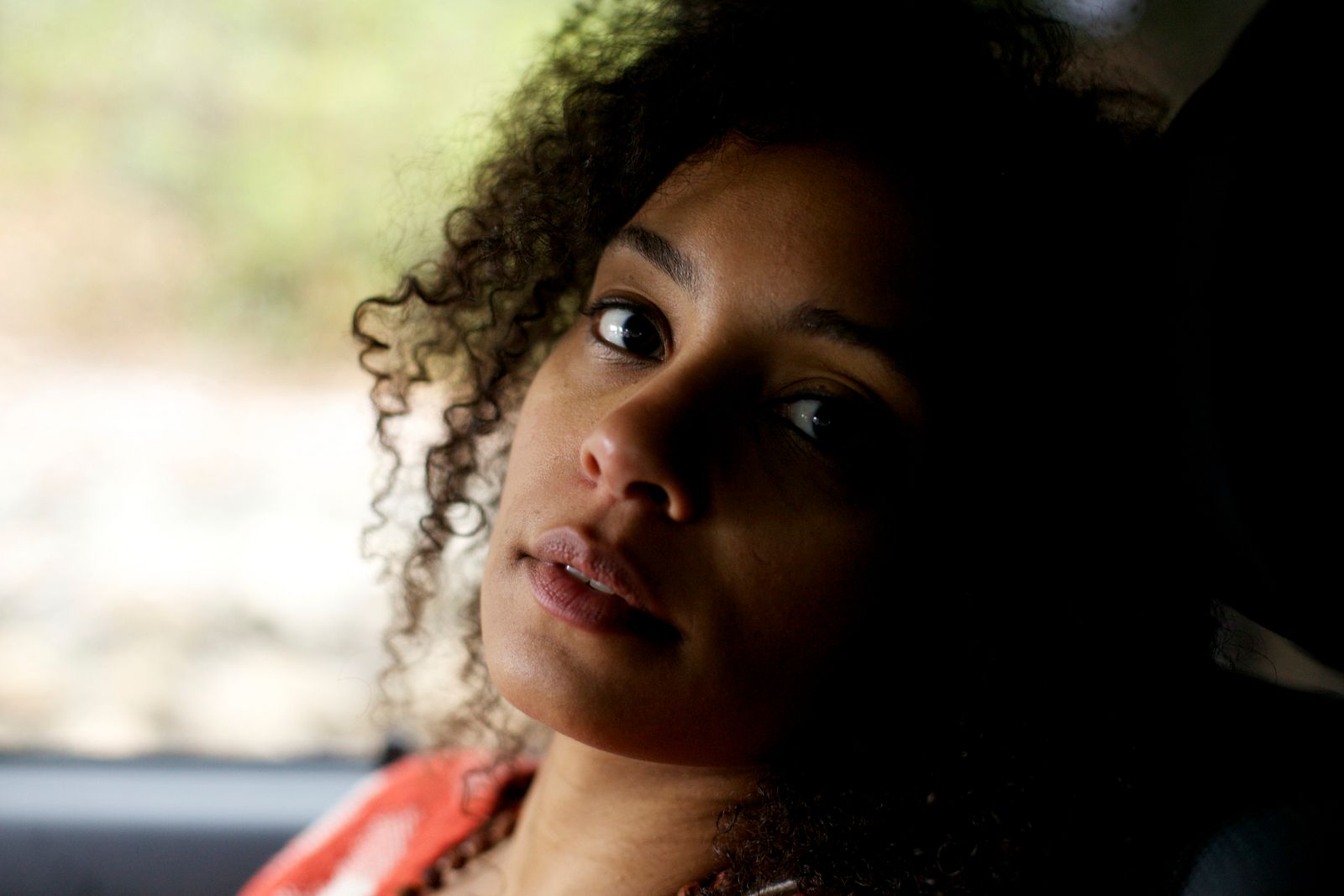 a close up of a person sitting in a car