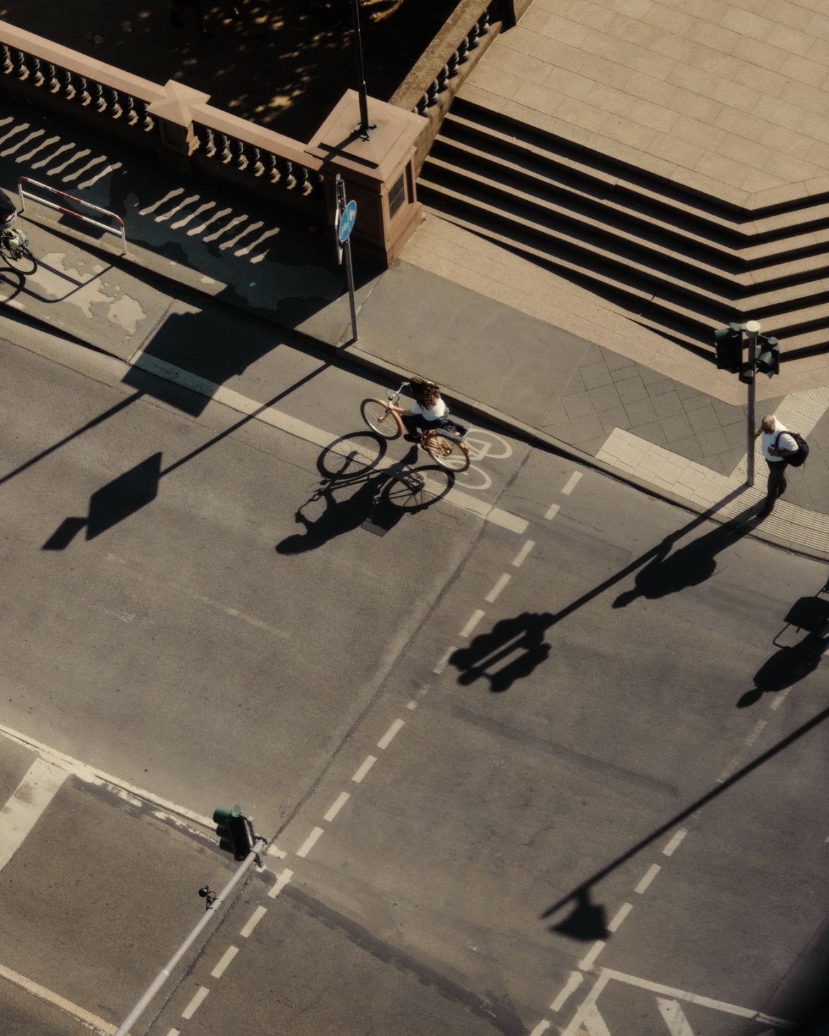 a group of people riding bikes down a street