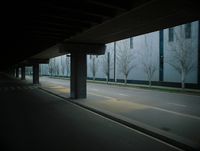 an empty parking garage with no cars on the road