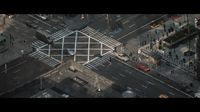 an aerial view of a city intersection with a crosswalk