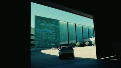 a car is parked in front of a building