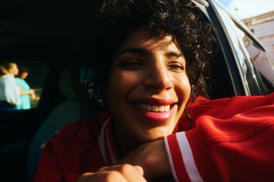 a close up of a person sitting in a car