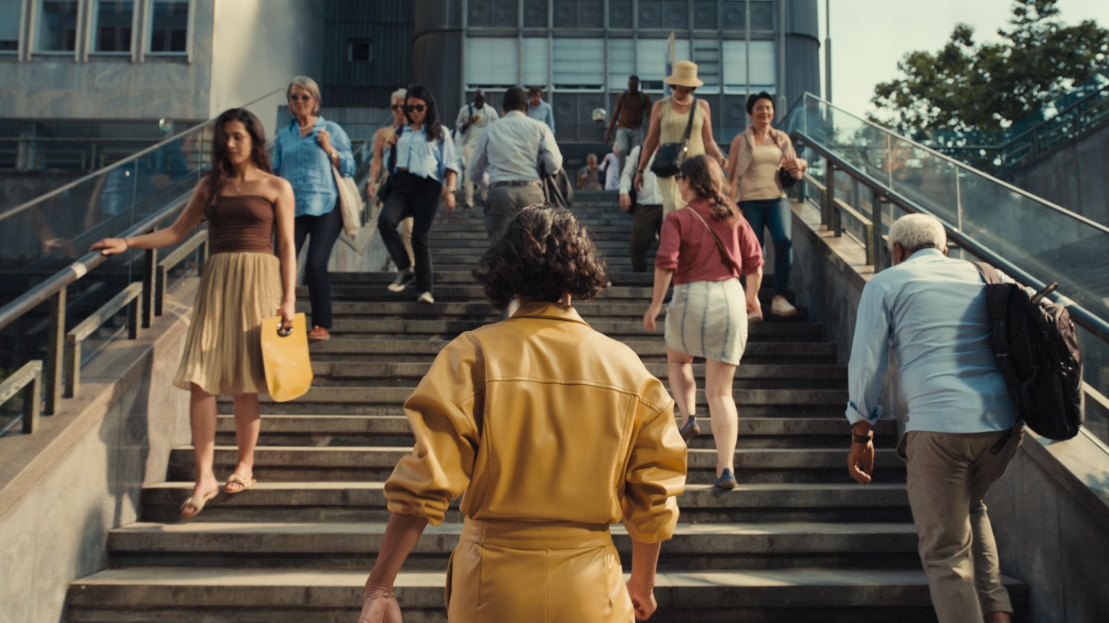 a group of people walking down a flight of stairs