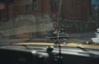 a man riding a motorcycle on a city street