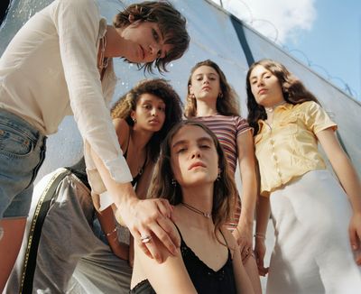 a group of young women standing next to each other