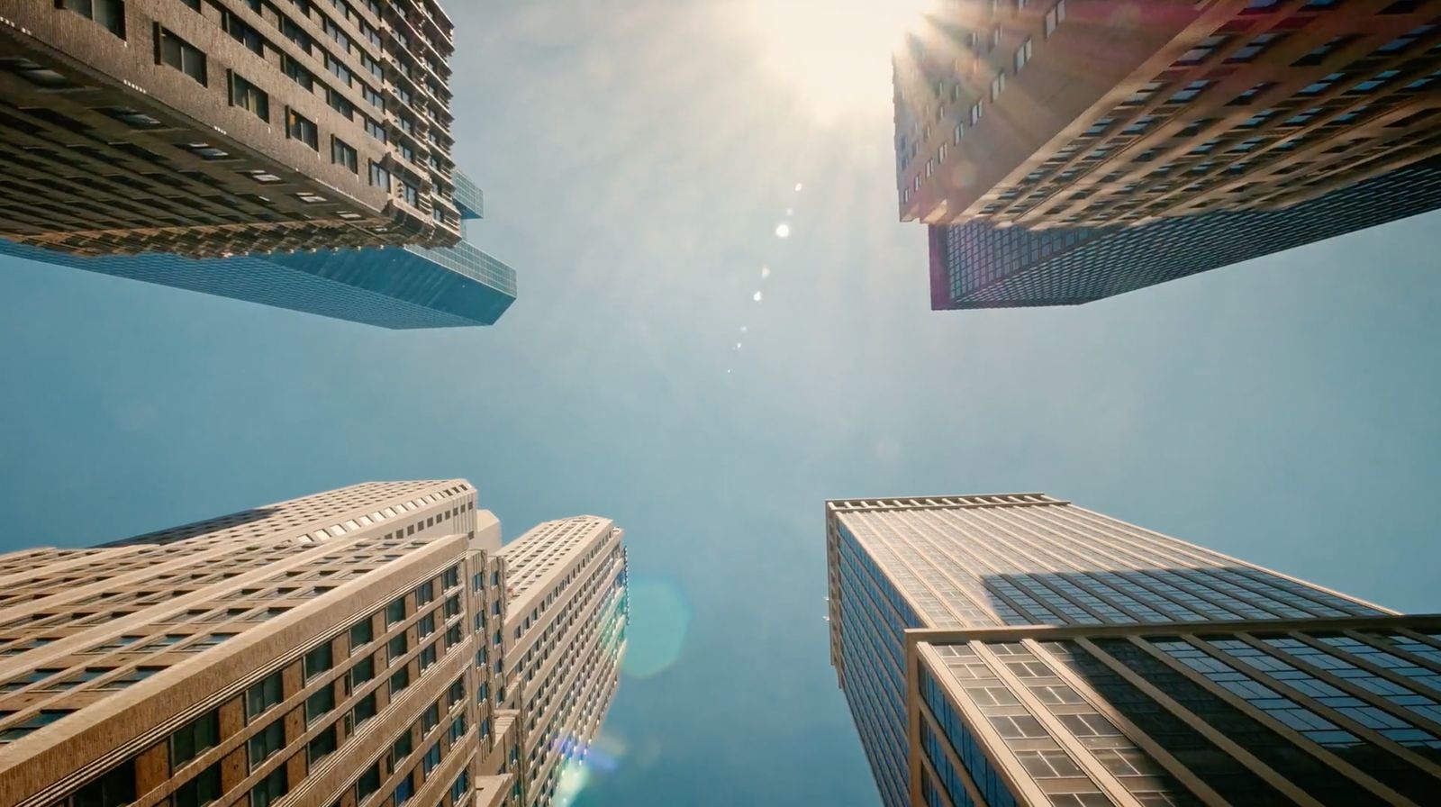 looking up at tall buildings in a city