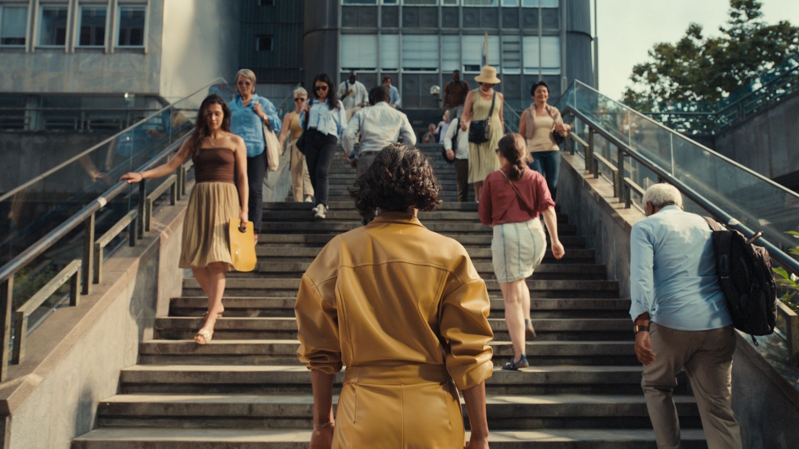 a group of people walking up a flight of stairs