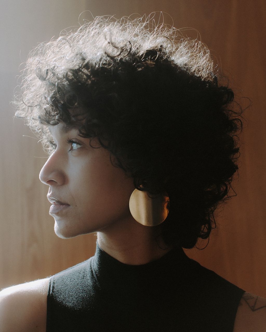 a close up of a person with curly hair