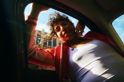 a woman in a car looking out the window